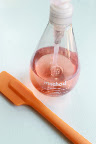 Pink hand soap and an orange spatula