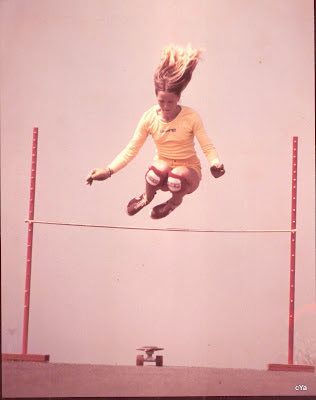 Robin with hair flying going over the high jump at La Costa!