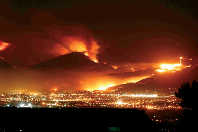 Northeastern San Bernardino, California, as the wildfires light up the night sky. Chris Doolittle
