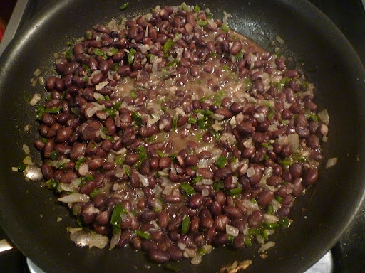 Add the beans to the sofrito along with a little water and simmer away.