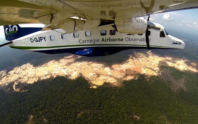 The Carnegie Airborne Observatory (CAO), an airplane used by researchers to conduct advanced monitoring and analysis of Peru's forests, flies over illegal gold mines in the Peruvian Amazon. More than 50,000 hectares have been affected by gold mining in just the southern part of the department of Madre do Dios, and the rate of expansion has nearly tripled in recent years, climbing from 2,166 hectares per year prior to 2008 to 6,145 thereafter. Photo: Carnegie Department of Global Ecology