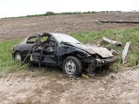 This car was blown from the driveway to across the road at 3229 Spruce Avenue This car was blown from the driveway to across the road at 3229 Spruce Avenue