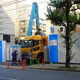 Construction sites in Tokyo are surrounded by tall metal walls, to block the noise and unsightliness