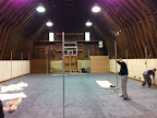 Once the carpet was laid, pipes were put up so fabric could be draped along the perimeter.