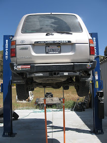 Mike's hydraulic lift out at his shop in Ramona makes jobs as this much easier.