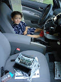 The CD player with the change it, and the little boy who put it there The CD player with the change it, and the little boy who put it there