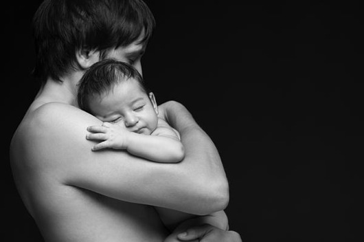 Father holding his newborn baby pavlo kolotenko