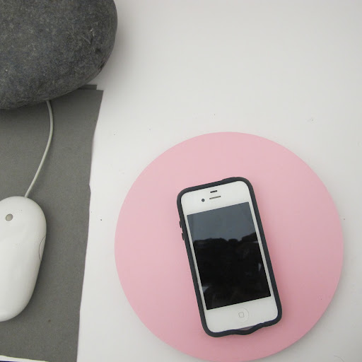 My iPhone rests on this simple painted wooden circle.