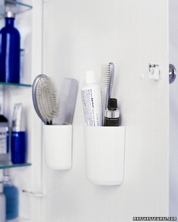 Combs, brushes, and toothpaste take up considerable space when laid horizontally on a shelf. Flat-backed, self-adhesive cups on the inside of the cabinet door hold them more efficiently. Combs, brushes, and toothpaste take up considerable space when laid horizontally on a shelf. Flat-backed, self-adhesive cups on the inside of the cabinet door hold them more efficiently.