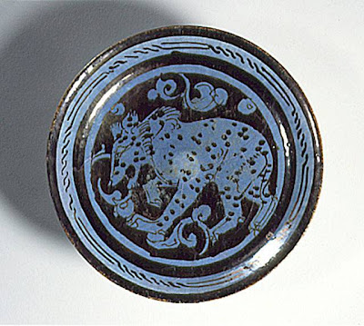 Plate Iran Plate, 12th century Ceramic; Vessel, Fritware, luster painted over a blue glaze, Height: 1 3/8 in . (3.5 cm ); Diameter: 7 in . (17.8 cm ) The Nasli M. Heeramaneck Collection, gift of Joan Palevsky (M.73.5.288) Art of the Middle East: Islamic Department.