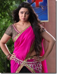 Actress Charmi posing in Pink Langa Voni Photos