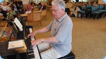 Jim Nicholson playing the grand piano making it look consumately easy! Photo courtesy of Dennis Lyons.