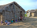 The King's main hut with his wife and several of his children sitting in the doorway. Madagascar6 - 091.jpg