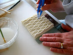 Step 7: And she does the same between the middle and the bottom.