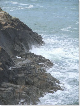 crashing sea over rocks