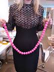 Naomi proudly shows our first strand of hot-pink gumballs. Naomi proudly shows our first strand of hot-pink gumballs.