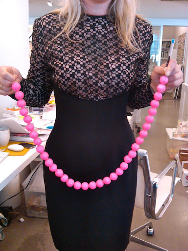 Naomi proudly shows our first strand of hot-pink gumballs. Naomi proudly shows our first strand of hot-pink gumballs.
