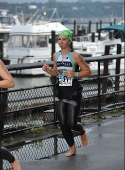 Here's another shot, this one from this year's NYC race. Once you get the zipper down, trot into transition with your suit stripped down around your waist.