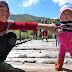 Kyrgyz nomads on a broken bridge in the Ferghana Range, Kyrgyzstan.