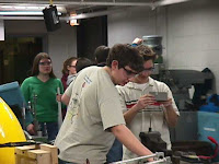 Students working on parts for the robot