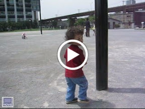Eidan pretending to crash into posts, at the park adjacent to World City Towers in Shinagawa