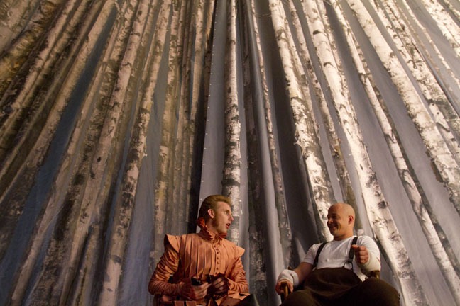 Actor Robert Emms and stuntman Peter Seaborne socialize next to a painted backdrop, "Snow White," September 12, 2011