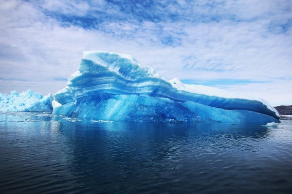 Calved icebergs from the nearby Twin Glaciers in Greenland are seen floating on the water in Summer 2012. In September 2013, a panel of climate experts said it was 95% certain that human activity is driving global warming. Photo: Joe Raedle / Getty Images