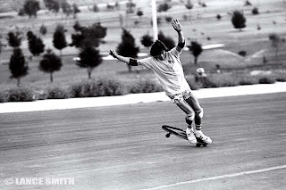 Carving out a 360 nose wheelie on the downhill