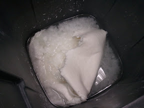 We start off with sheets of pulp that are processed for handpapermaking.  Our two most used fibers are cotton and abaca (related to the banana plant).  Here are two pounds of cotton soaking, ready to go into the Hollander beater to make pulp.