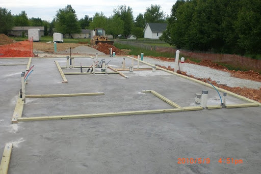 The structure of the Kindgom Hall started to take shape with electric and water hook-ups. (Photo by Art Morris)
