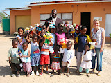 And here's the whole group in front of their house, along with David Khosa, the community projects coordinator for Ulusaba's Pride 'n Purpose. South Africa - 408.jpg