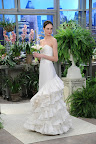 Here, Oscar's silk taffeta and organza strapless gown with tiered ruffle train.