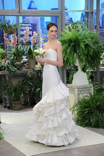Here, Oscar's silk taffeta and organza strapless gown with tiered ruffle train.