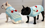 The pom-pom embellishment is supposed to look like a winter scarf tied around the neck.