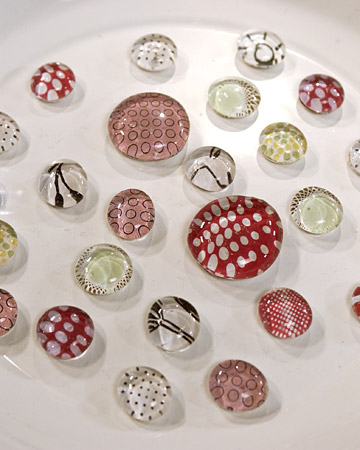 A magnet Good Thing made with flattened glass beads and decorative papers. (OAD: 5/1/2003)