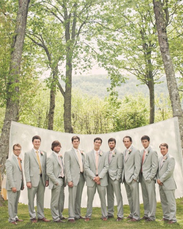Groom Julian and his groomsmen wore light-gray suits and ties in a range of sherbet-inspired hues. Groom Julian and his groomsmen wore light-gray suits and ties in a range of sherbet-inspired hues.