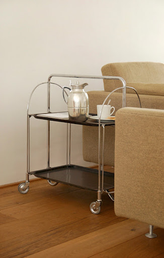 The next few images were taken from Desire To Inspire. I love this side table that also functions as tray and dining cart.