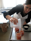 Kristina (our food editor) pouring the hot cider into the glasses.