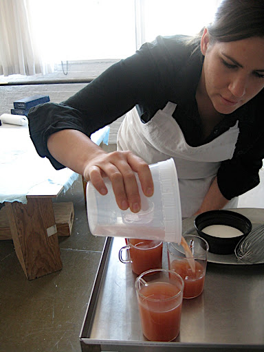 Kristina (our food editor) pouring the hot cider into the glasses.