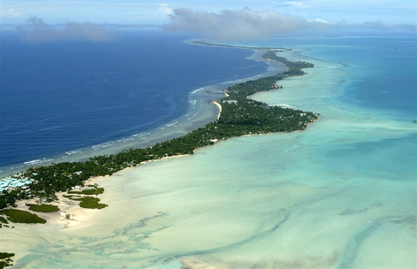 Authorities in Kiribati, seen here in an aerial photo taken in 2004, have been considering several unusual options to combat climate change, including constructing sea walls and even building a floating island. Richard Vogel / AP, file