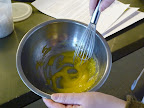 Whisk the remaining sugar together with the egg yolk