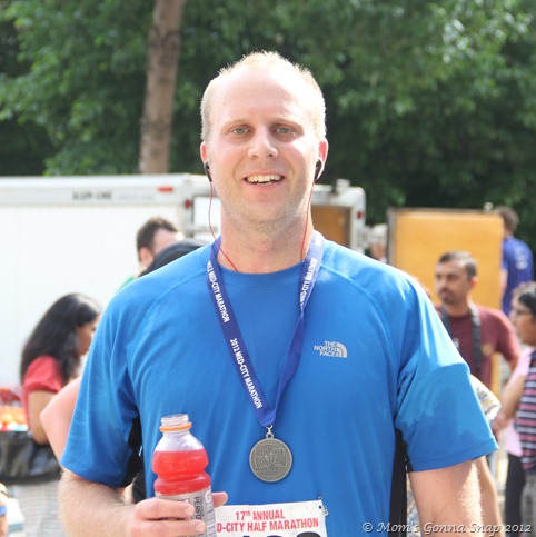 He looks pretty good for just running 13.1 miles in extremely hot weather!