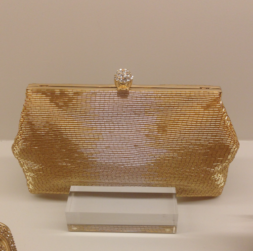 The new shop also carries the brand's accessories, such as this reception-ready clutch in gold for you ... The new shop also carries the brand's accessories, such as this reception-ready clutch in gold for you ...