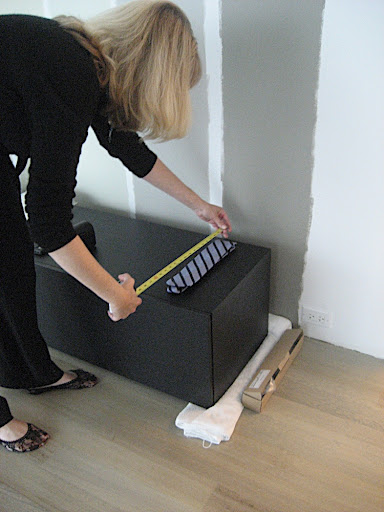 Ginny Snook Scott, another California Closets designer, starts to measure my ties.