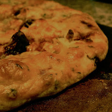 Three Cheese Herb Galette with Caramelized Onion and Roasted Garlic Compote, Figs, and Prosciutto