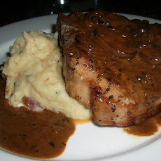 Grilled Pork Chop with Brandy Mushroom Sauce