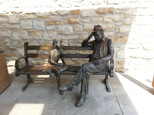 Bronze Statue of Little Girl and Old Man