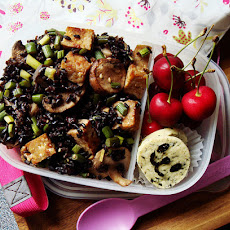 Stir Fried Forbidden Black Rice with Tempeh, Garlic Scapes, Crimini