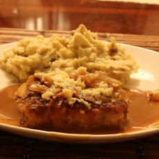 Pork Chops With Caramelized Onions and Smoked Gouda