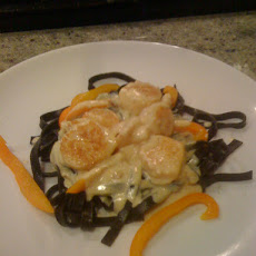 Shrimp and Scallops in Saffron Cream with Black Pasta